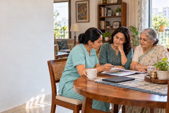A nurse explaining a home-care plan to an older woman and her daughter